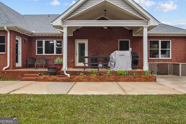 view of front of house featuring a front lawn and a patio