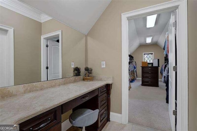 bathroom featuring vanity and lofted ceiling