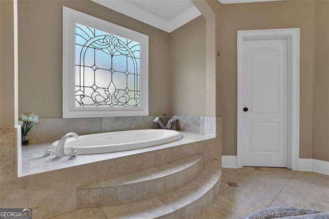 bathroom featuring tile patterned floors, ornamental molding, and tiled bath