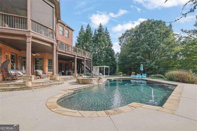 view of pool featuring an in ground hot tub and a patio area