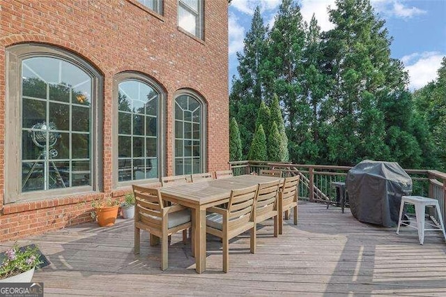 wooden deck featuring grilling area