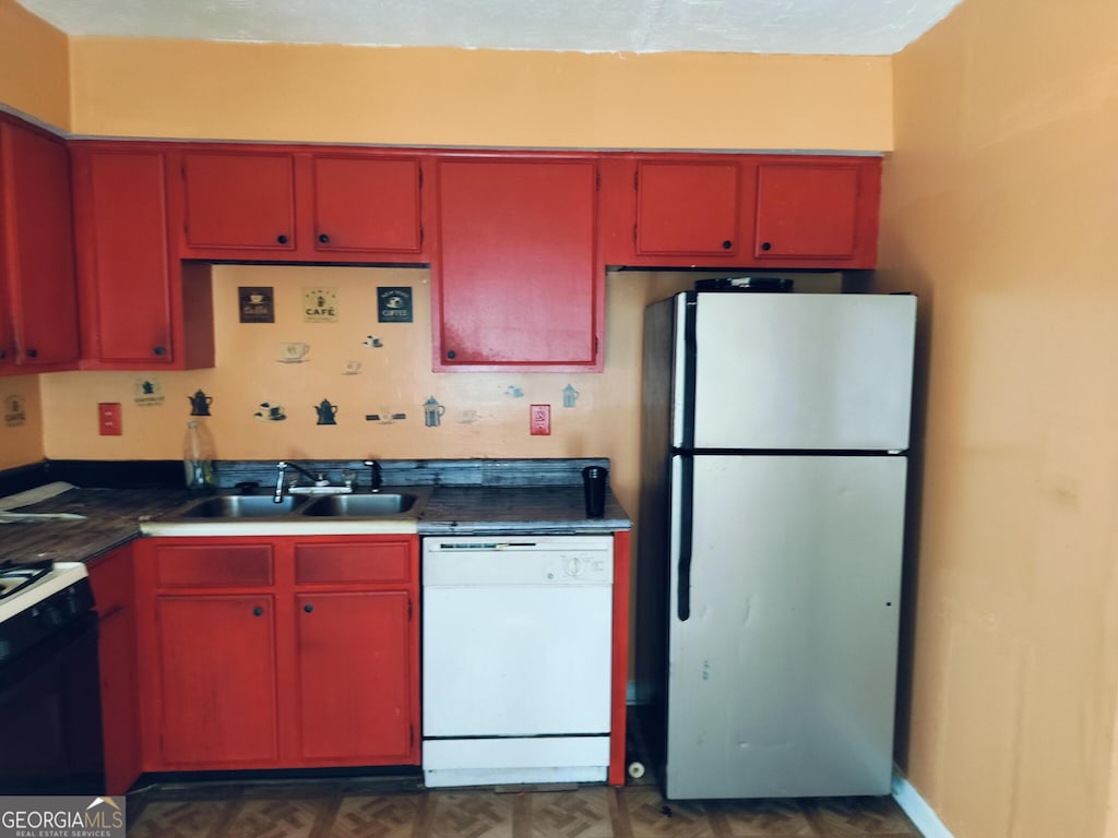 kitchen featuring sink and white appliances