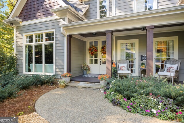 doorway to property featuring a porch