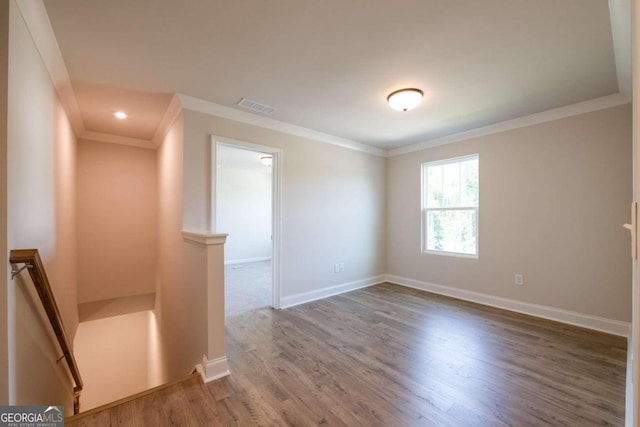 134 Henley St W Unit 09, Canton, GA 30114 - empty room with ornamental molding, wood finished floors, baseboards, and recessed lighting