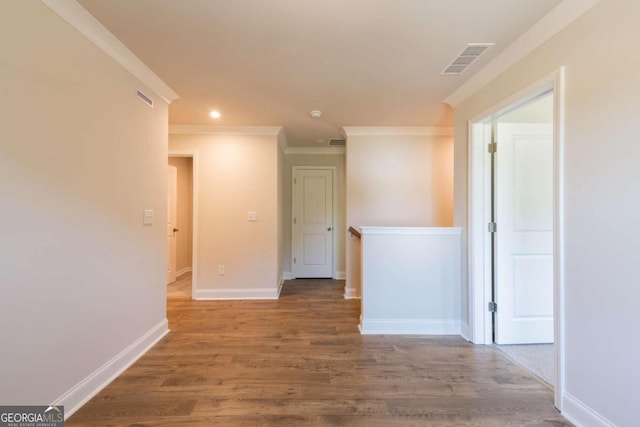 134 Henley St W Unit 09, Canton, GA 30114 - unfurnished room with ornamental molding, baseboards, wood finished floors, and recessed lighting
