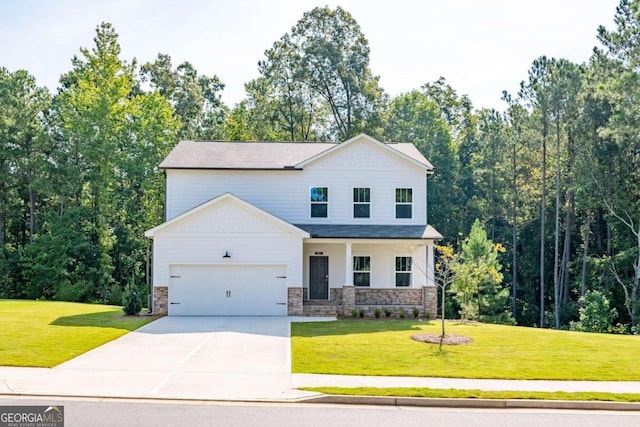 134 Henley St W Unit 09, Canton, GA 30114 - view of front of home with an attached garage, driveway, a front yard, and stone siding