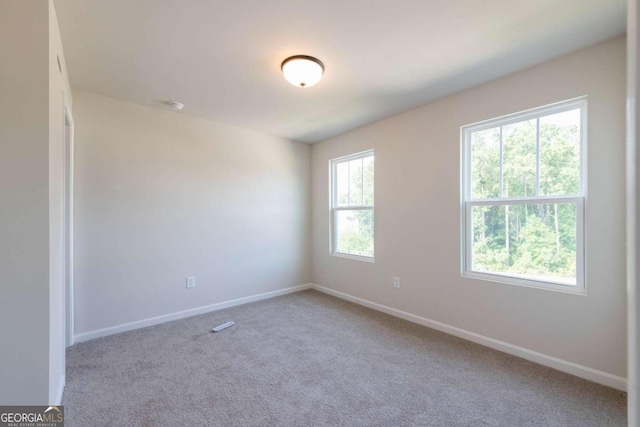 134 Henley St W Unit 09, Canton, GA 30114 - carpeted spare room featuring baseboards