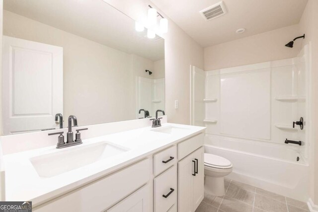 134 Henley St W Unit 09, Canton, GA 30114 - bathroom featuring toilet, shower / bath combination, tile patterned floors, and double vanity