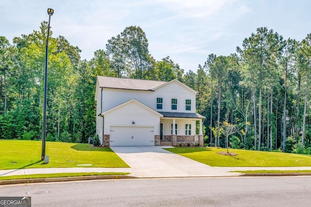 134 Henley St W Unit 09, Canton, GA 30114 - view of front facade featuring a garage, covered porch, a front lawn, and concrete driveway