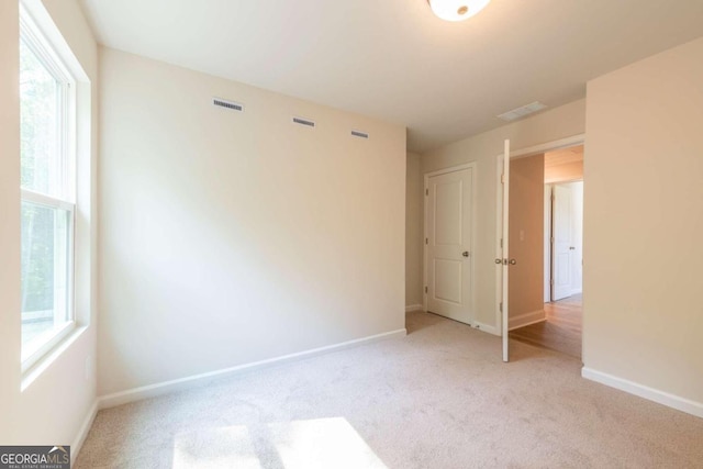 134 Henley St W Unit 09, Canton, GA 30114 - carpeted empty room featuring baseboards