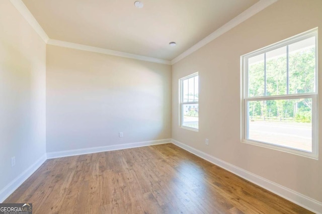 134 Henley St W Unit 09, Canton, GA 30114 - spare room featuring ornamental molding, baseboards, and wood finished floors