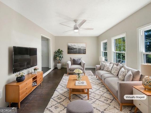 living room with dark hardwood / wood-style floors and ceiling fan