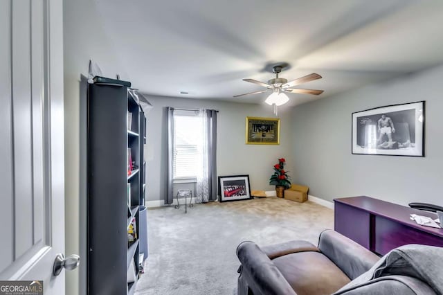 interior space with light carpet and ceiling fan