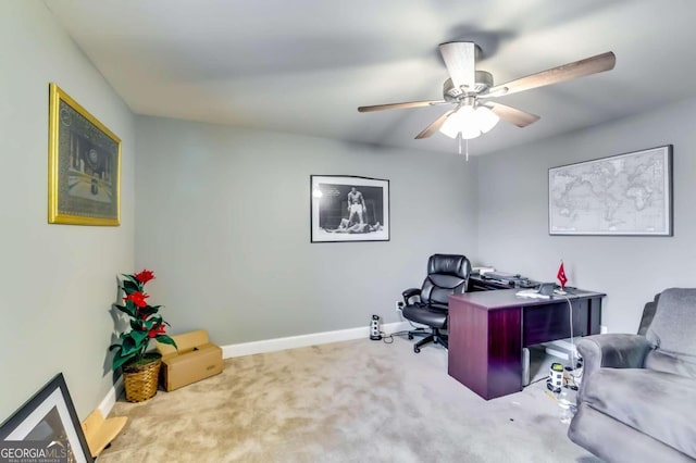 carpeted office featuring ceiling fan