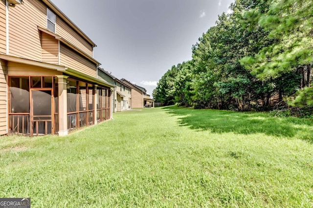 view of yard featuring a sunroom