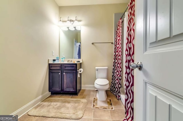 bathroom featuring vanity, toilet, and tile patterned floors