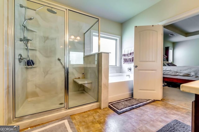 bathroom with separate shower and tub