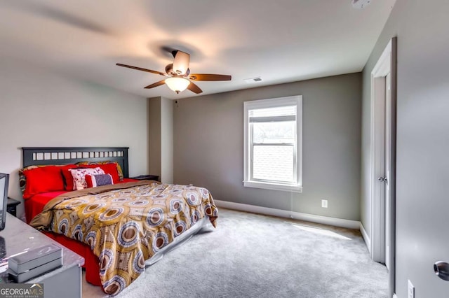 bedroom featuring light carpet and ceiling fan