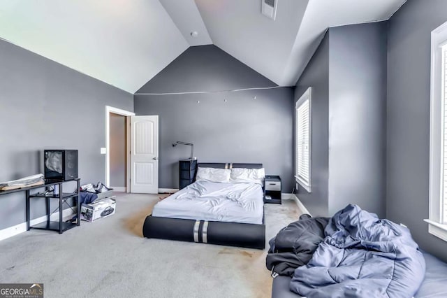 carpeted bedroom featuring lofted ceiling