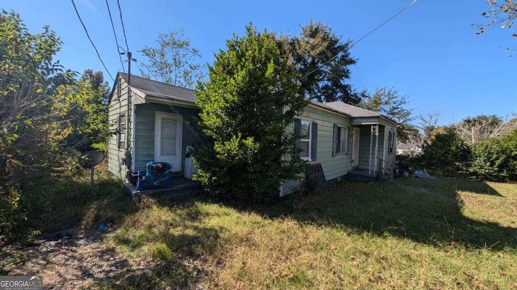 968 Quinlan Dr, Macon, GA 31206 - view of side of home featuring a lawn