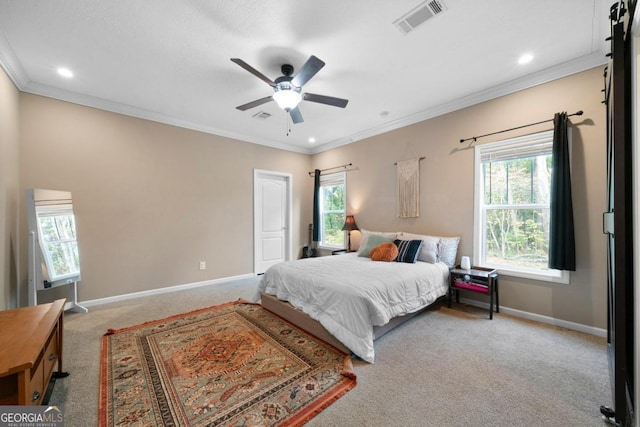 bedroom featuring ceiling fan, light carpet, and crown molding