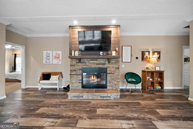 living room with a fireplace, ornamental molding, and dark hardwood / wood-style floors