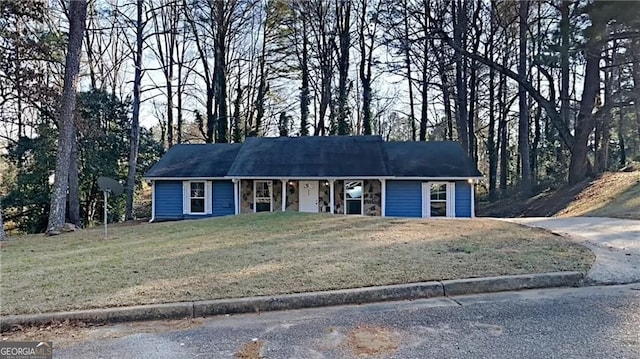 ranch-style house with a front yard