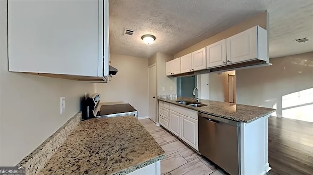 kitchen with appliances with stainless steel finishes, white cabinets, and sink