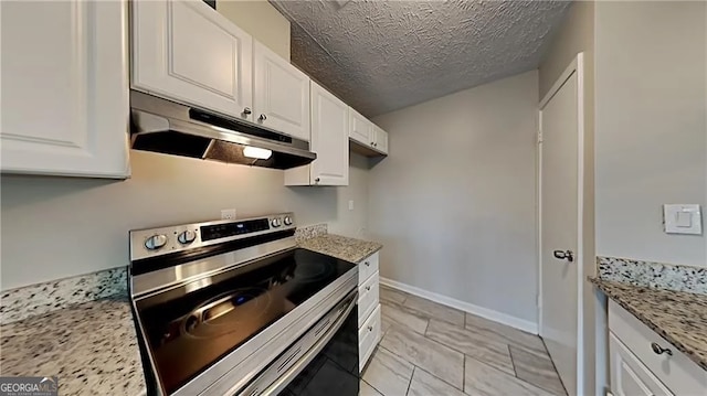 kitchen featuring white cabinetry, light stone countertops, a textured ceiling, and stainless steel electric range oven