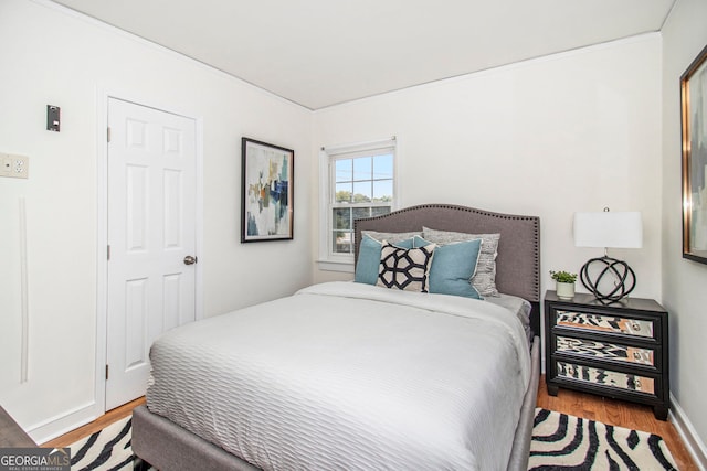 bedroom with light hardwood / wood-style flooring