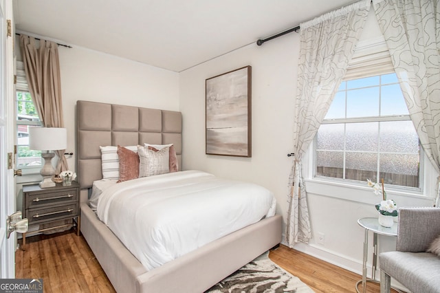 bedroom featuring wood-type flooring