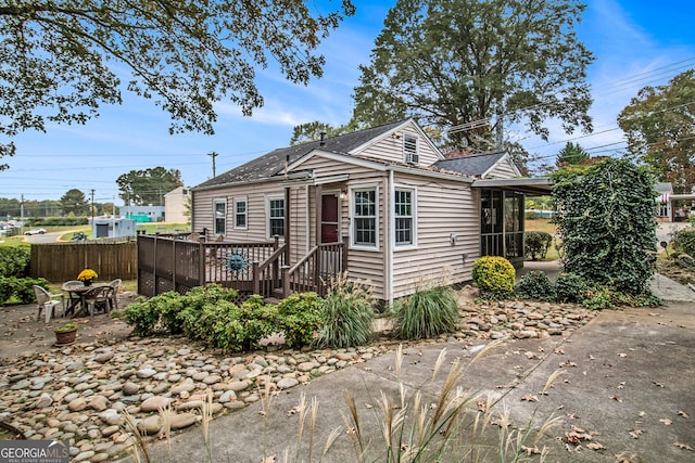 view of front of home with a patio and a deck