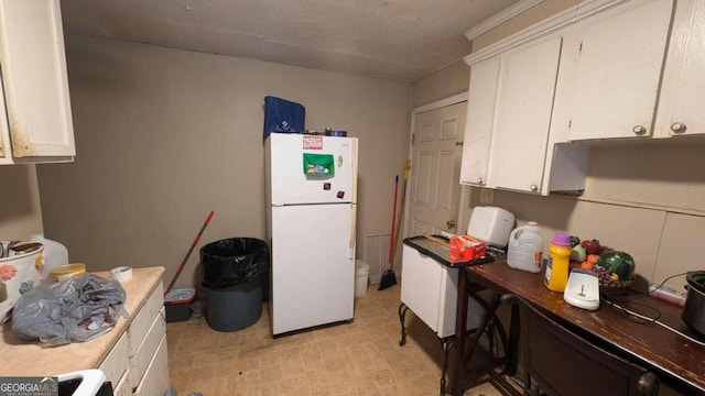 646 Straight St, Macon, GA 31204 - kitchen with white cabinetry and white refrigerator