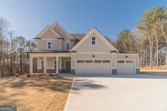 view of front of house featuring a porch and a garage