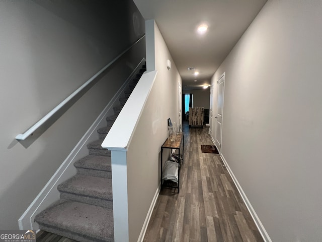 staircase featuring hardwood / wood-style floors