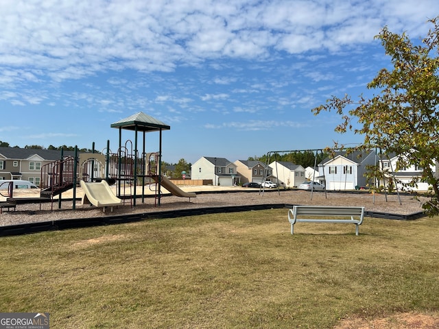 view of playground with a lawn