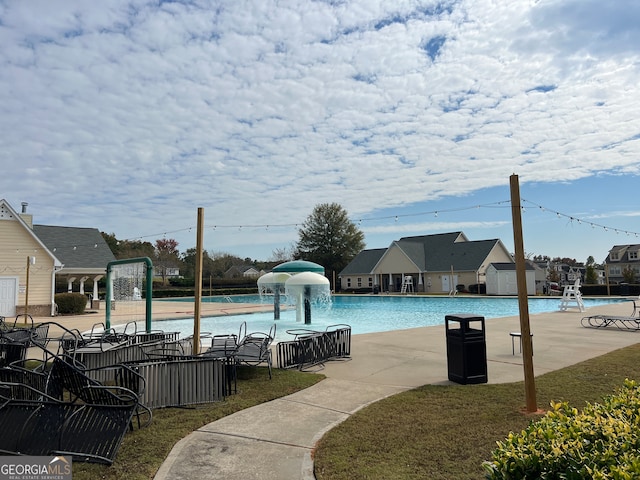 view of swimming pool featuring a patio area and pool water feature