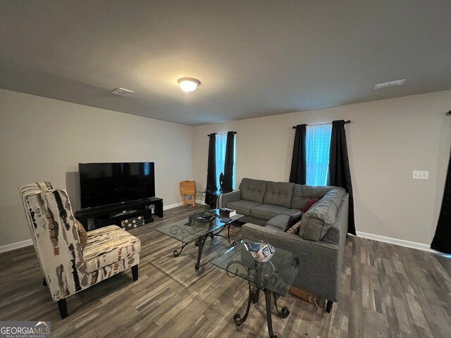 living room with dark hardwood / wood-style floors