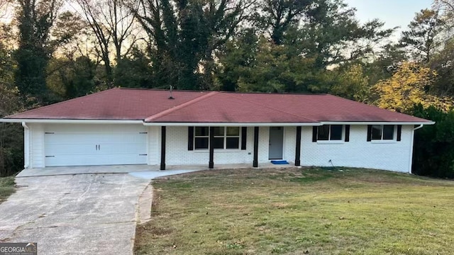 single story home with a front lawn and a garage