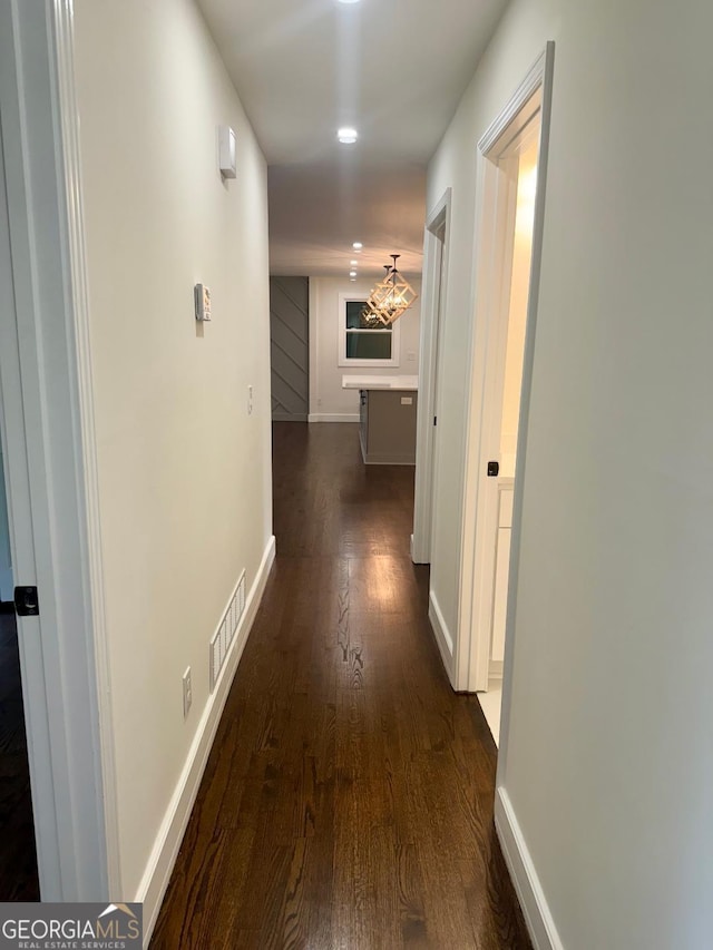 hall with dark hardwood / wood-style floors