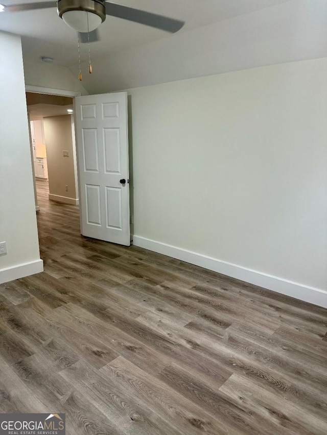 empty room featuring hardwood / wood-style floors and ceiling fan