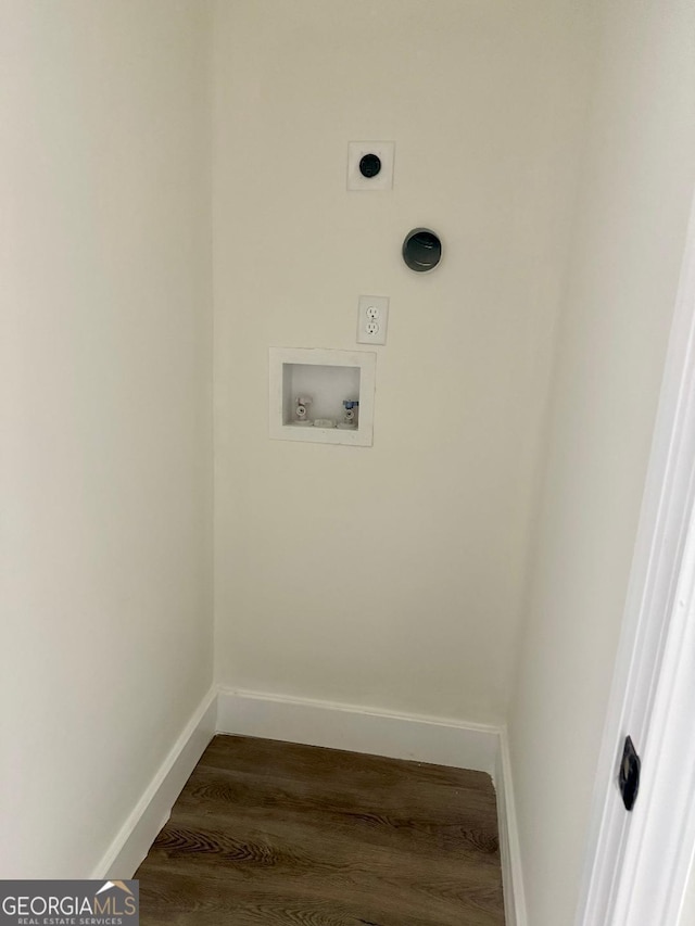 washroom with hookup for an electric dryer, hookup for a washing machine, and hardwood / wood-style flooring