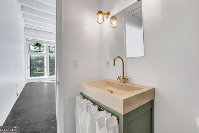 bathroom with vanity and concrete floors