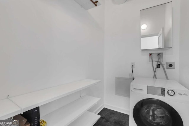 washroom with washer / dryer