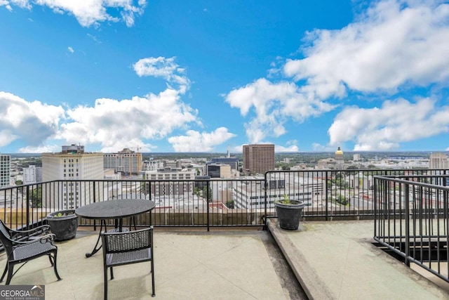 view of patio featuring a balcony