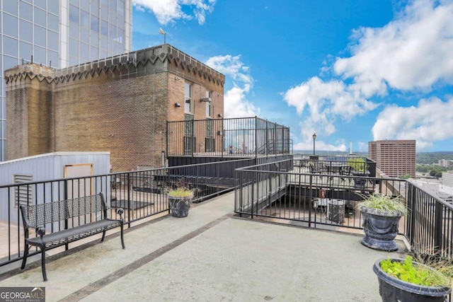 view of patio with a balcony