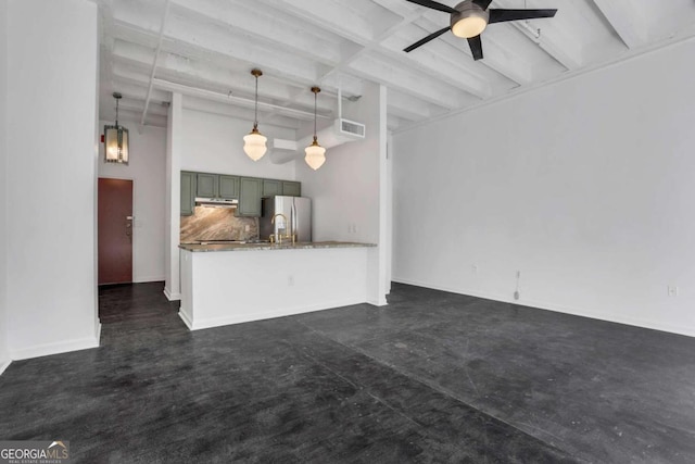 unfurnished living room with beam ceiling and ceiling fan