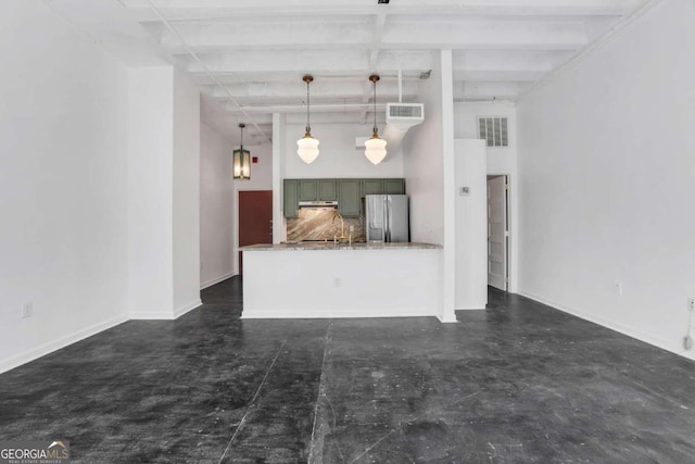 kitchen with beam ceiling, decorative light fixtures, light stone counters, and stainless steel refrigerator with ice dispenser