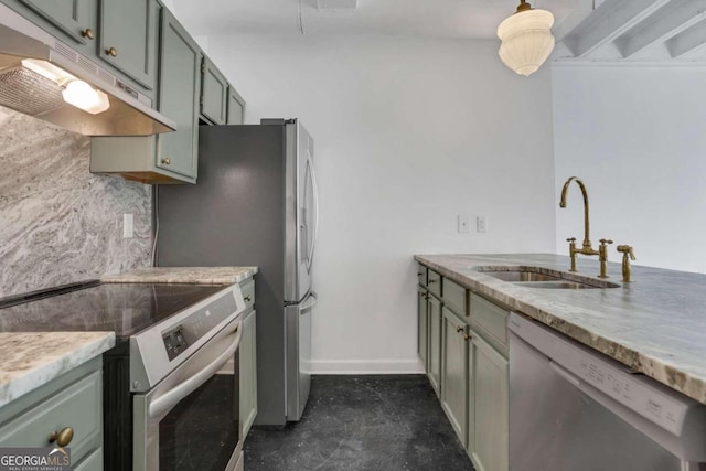 kitchen featuring stainless steel appliances, light stone countertops, and sink