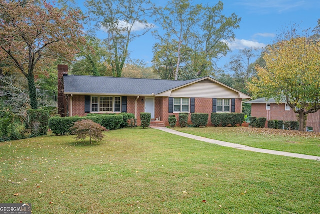 ranch-style home featuring a front yard